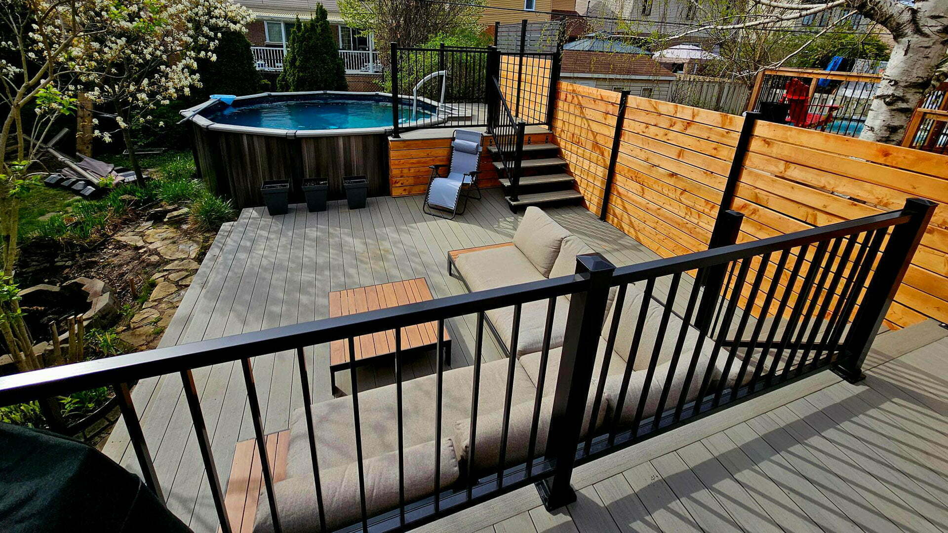 Backyard pool with black aluminium raillings.