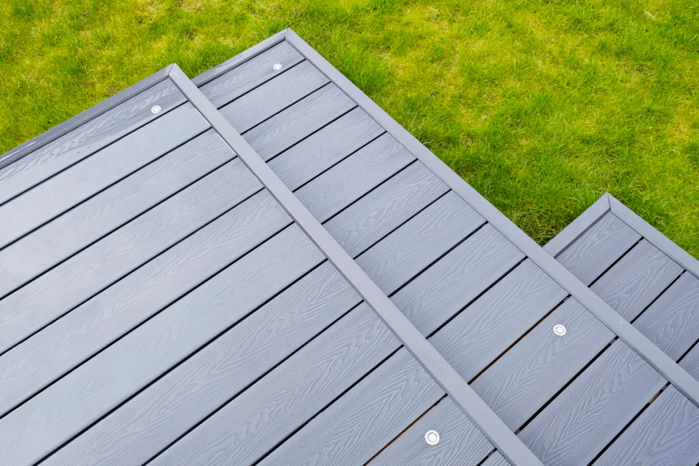 Ash grey composite decking showing the full grain of the decking boards